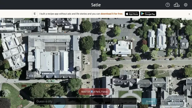 Satle satellite city view showing distance and direction after a Paris guess